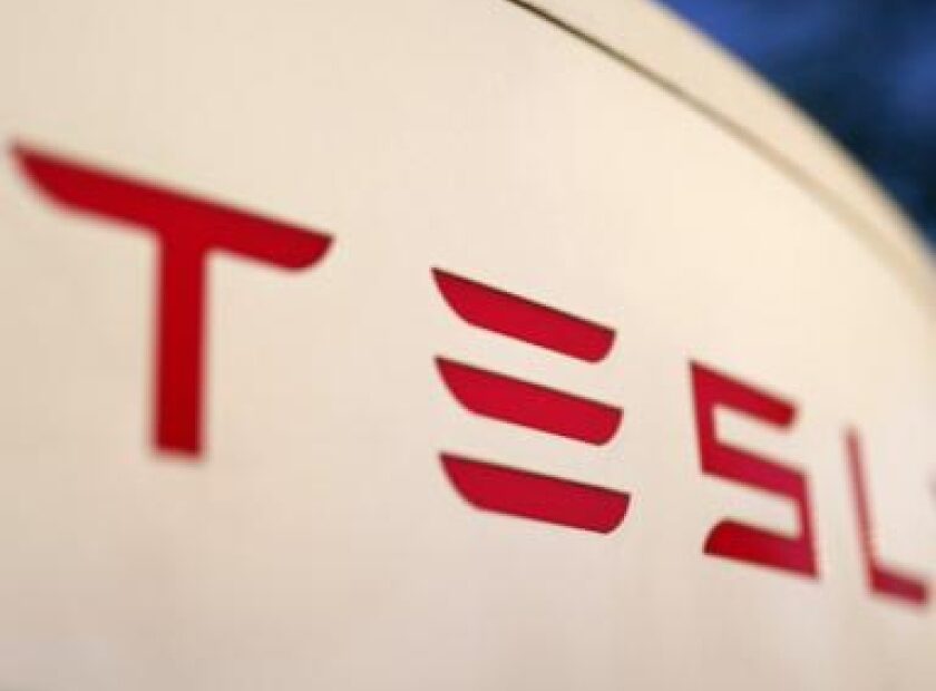 Tesla settles lawsuit over man’s death in a crash involving its semi-autonomous driving software